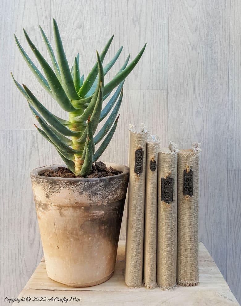 Do you like making a stylish statement while indulging your reading obsession? Then you&rsquo;re going to love these easy to make linen book covers with metal tags. Not only can you dress up your old or new books up in new attire, but you can customise the tutorial to suit your d&eacute;cor style. #DIYBookCovers #ACraftyMix #StylishBooks