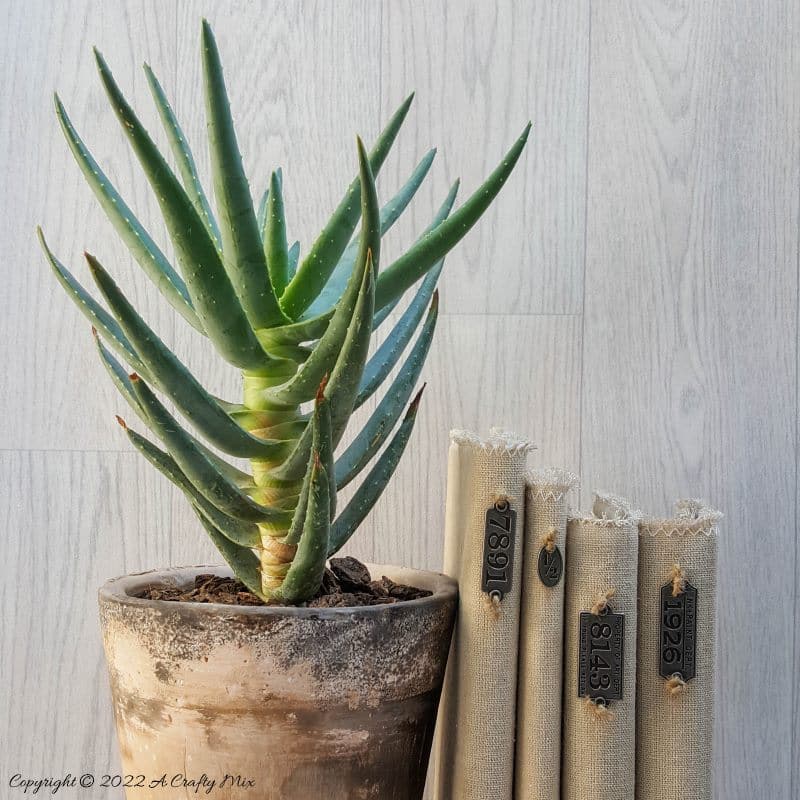 Do you like making a stylish statement while indulging your reading obsession? Then you&rsquo;re going to love these easy to make linen book covers with metal tags. Not only can you dress up your old or new books up in new attire, but you can customise the tutorial to suit your d&eacute;cor style. #DIYBookCovers #ACraftyMix #StylishBooks