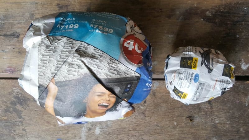 Roll the newspaper into two balls. One large and one medium