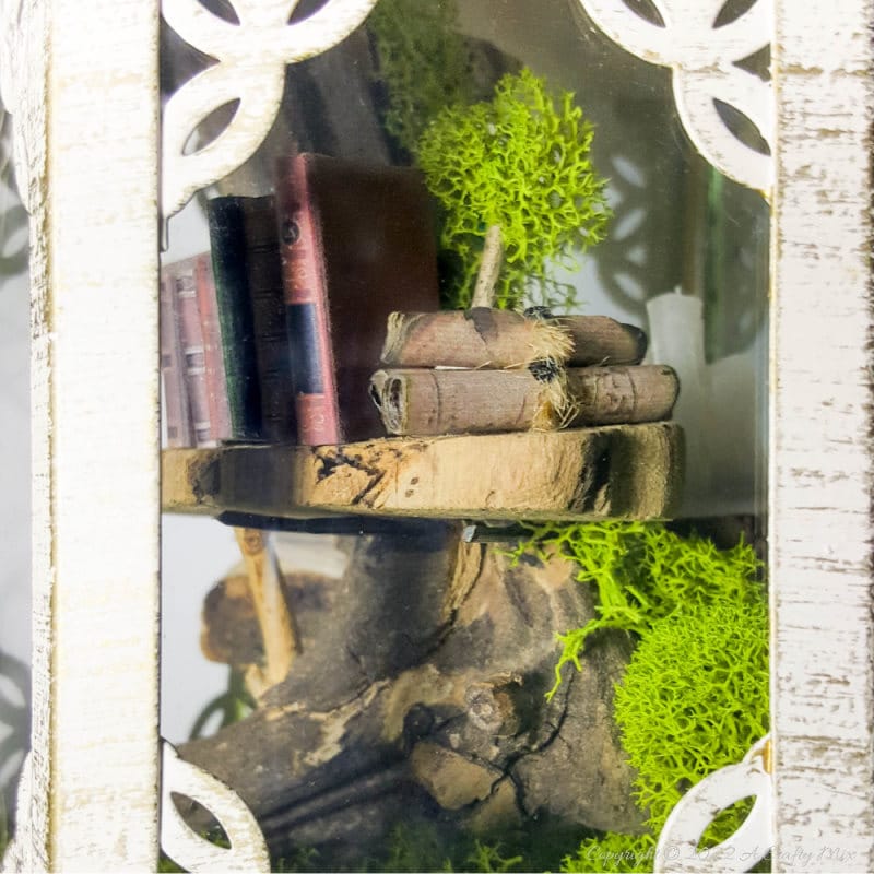 One of the reasons I love miniatures so much is how they draw the viewer in and encourage deeper scrutiny. Like this DIY pixie den lantern. It&rsquo;s filled with ancient scrolls, fairy-tale artifacts and a light that casts a magical glow over everything. Make your own with this photo-rich tutorial #FairyGarden #ACraftyMix #CraftTutorial