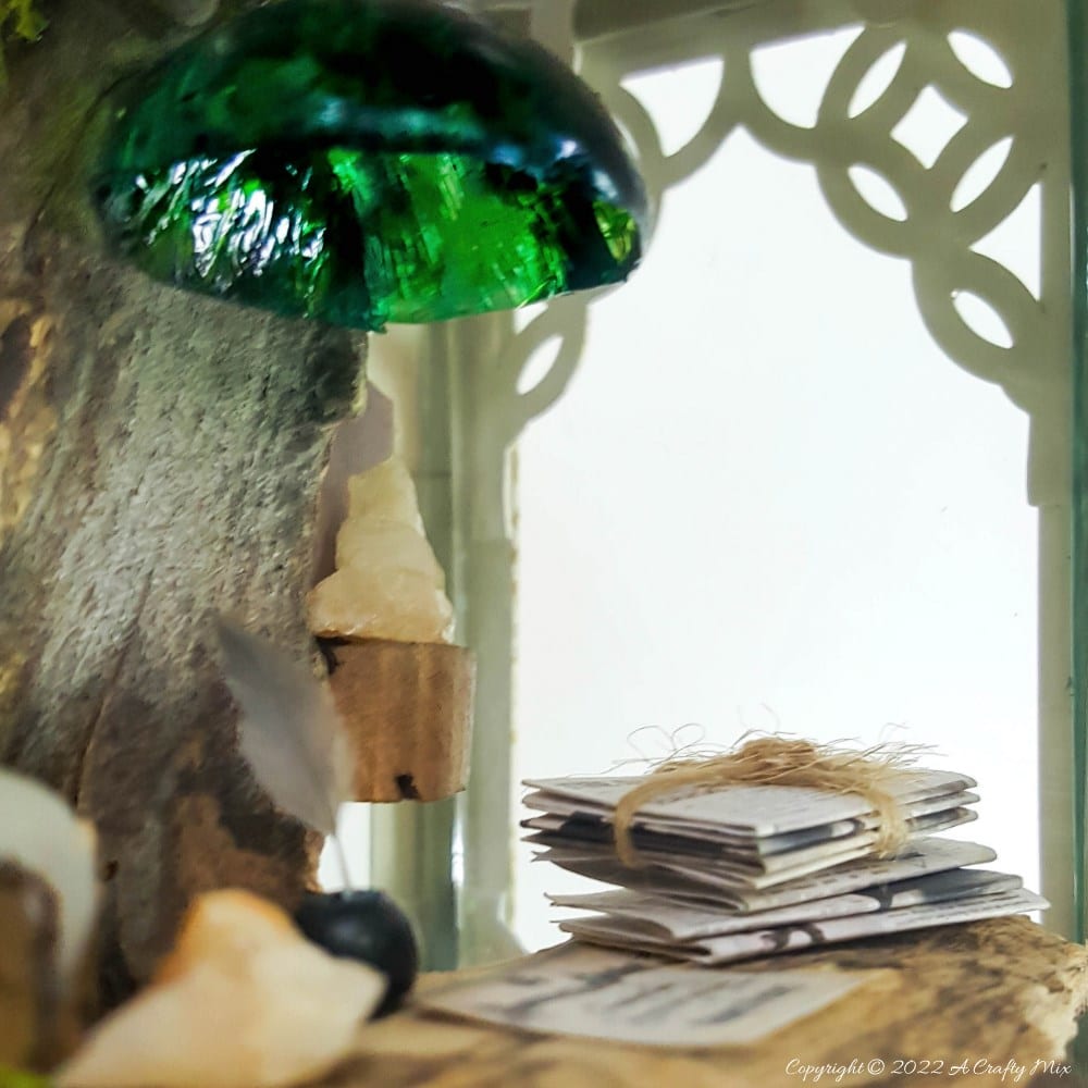 One of the reasons I love miniatures so much is how they draw the viewer in and encourage deeper scrutiny. Like this DIY pixie den lantern. It&rsquo;s filled with ancient scrolls, fairy-tale artifacts and a light that casts a magical glow over everything. Make your own with this photo-rich tutorial #FairyGarden #ACraftyMix #CraftTutorial