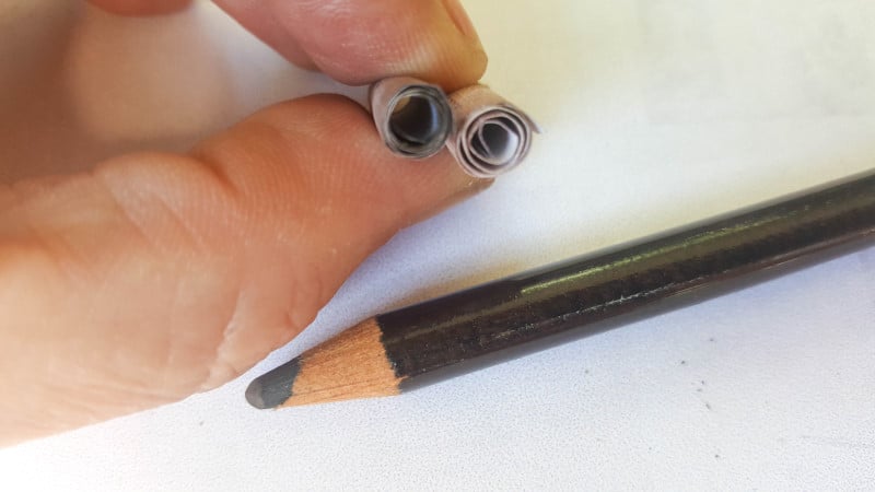 Use a pastel or soft pencil to distress the edges of the pixie scrolls