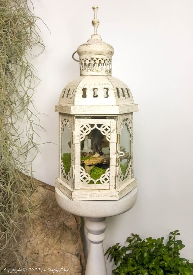 One of the reasons I love miniatures so much is how they draw the viewer in and encourage deeper scrutiny. Like this DIY pixie den lantern. It&rsquo;s filled with ancient scrolls, fairy-tale artifacts and a light that casts a magical glow over everything. Make your own with this photo-rich tutorial #FairyGarden #ACraftyMix #CraftTutorial