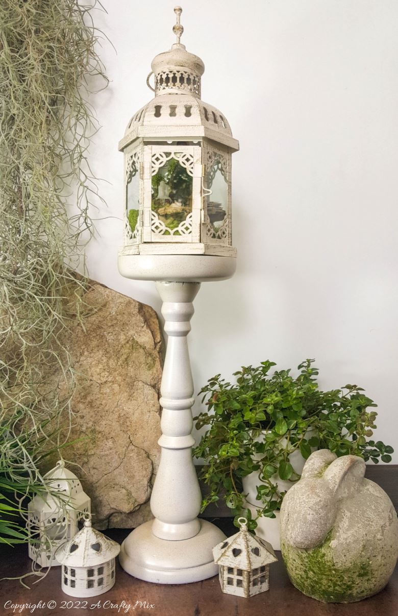 One of the reasons I love miniatures so much is how they draw the viewer in and encourage deeper scrutiny. Like this DIY pixie den lantern. It&rsquo;s filled with ancient scrolls, fairy-tale artifacts and a light that casts a magical glow over everything. Make your own with this photo-rich tutorial #FairyGarden #ACraftyMix #CraftTutorial