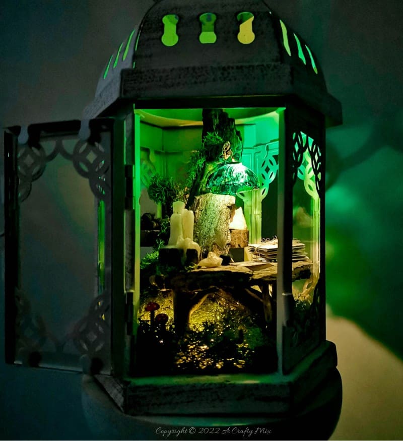 One of the reasons I love miniatures so much is how they draw the viewer in and encourage deeper scrutiny. Like this DIY pixie den lantern. It&rsquo;s filled with ancient scrolls, fairy-tale artifacts and a light that casts a magical glow over everything. Make your own with this photo-rich tutorial #FairyGarden #ACraftyMix #CraftTutorial