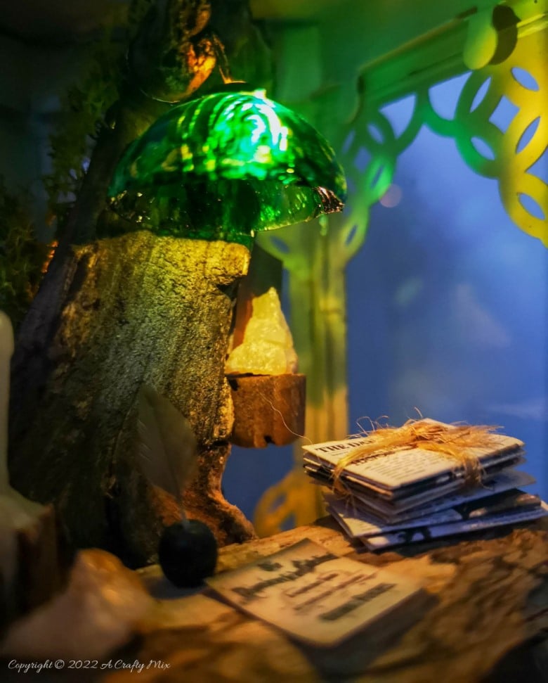 One of the reasons I love miniatures so much is how they draw the viewer in and encourage deeper scrutiny. Like this DIY pixie den lantern. It&rsquo;s filled with ancient scrolls, fairy-tale artifacts and a light that casts a magical glow over everything. Make your own with this photo-rich tutorial #FairyGarden #ACraftyMix #CraftTutorial