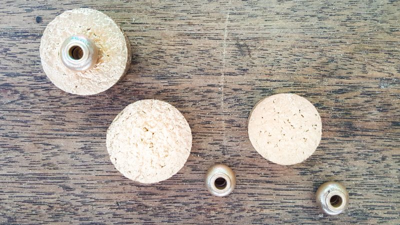 To finish off spray the cork lids gold and glue on a painted bead