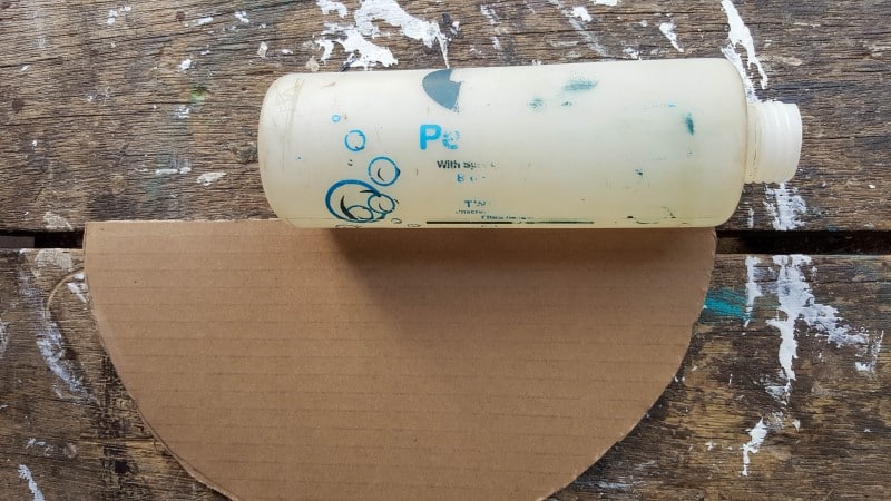 Cut the cardboard circles in half
