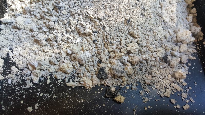 A close up of the hard lumpy bits in the charcoal ash
