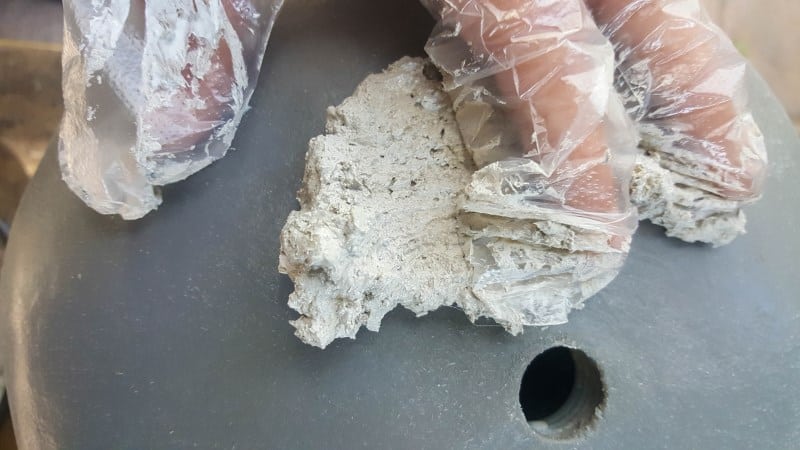 Apply the charcoal ash texture paste with your hands