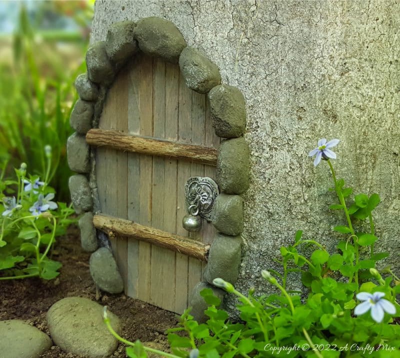 We all need a little fun and magic in the garden, which is why we made this “Not Mushroom” fairy house planter. And while the mushroom looks like it was cast in concrete, it actually uses a large polystyrene form as a base. Come see how we made this one. #Gardendecor #Acraftymix #fairygarden