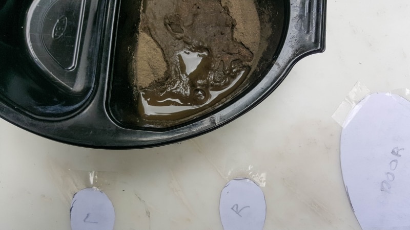 Mix up a small batch of Quikcrete or use leftover concrete mix to make stones
