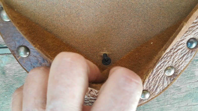 Add a wood screw on the inside of the pocket