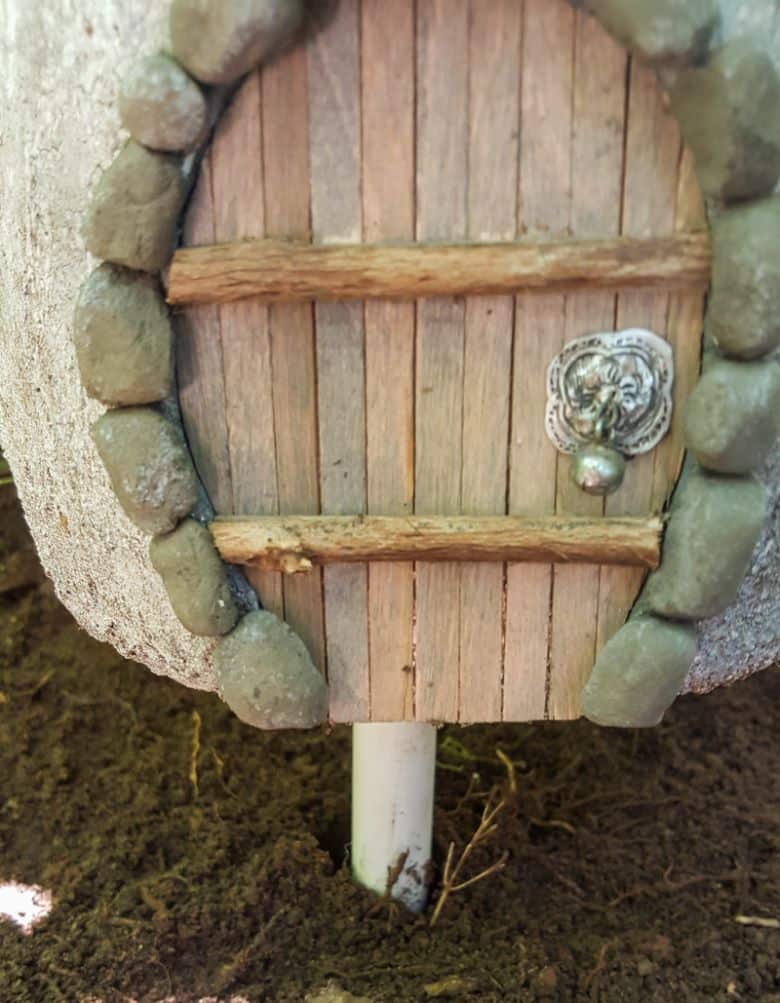 Slide the mushroom planter onto the pvc pipe
