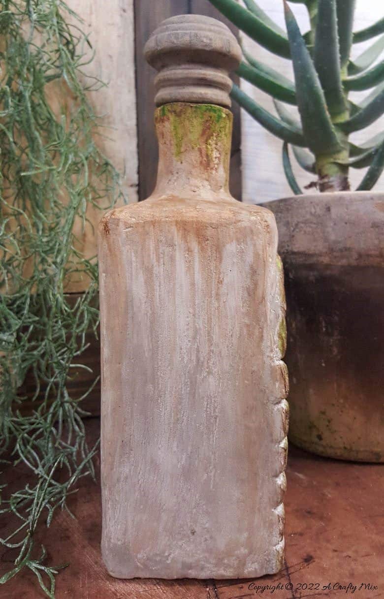 Welcome, fairy lovers! I had so much fun creating this feathered fairy throne in a fantasy bottle after seeing altered bottles in my Pinterest feed. It lights up and once I had everything figured out, it was really easy to make too. #ACraftyMix #AlteredBottle