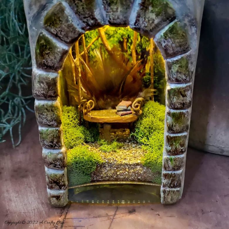 Welcome, fairy lovers! I had so much fun creating this feathered fairy throne in a fantasy bottle after seeing altered bottles in my Pinterest feed. It lights up and once I had everything figured out, it was really easy to make too. #ACraftyMix #AlteredBottle