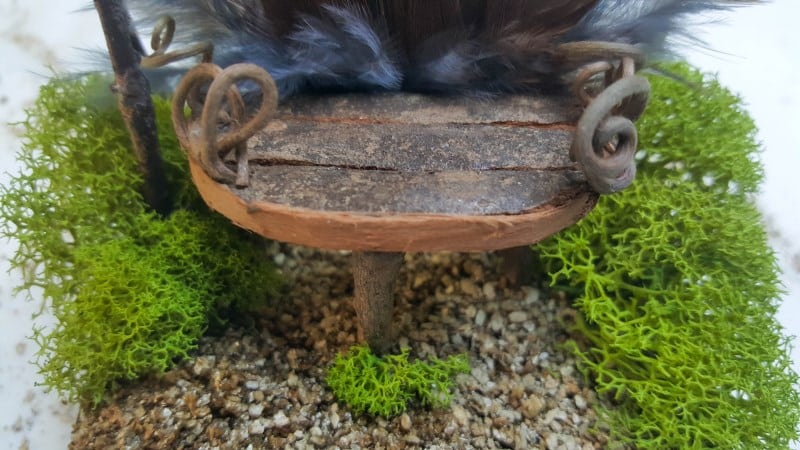 Glue the feathered fairy throne down