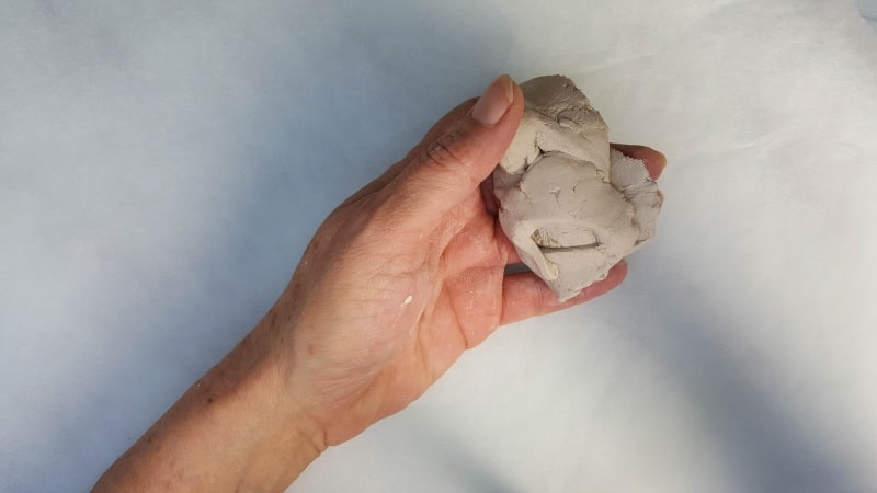 Knead the air dry clay to remove any air bubbles and soften it up