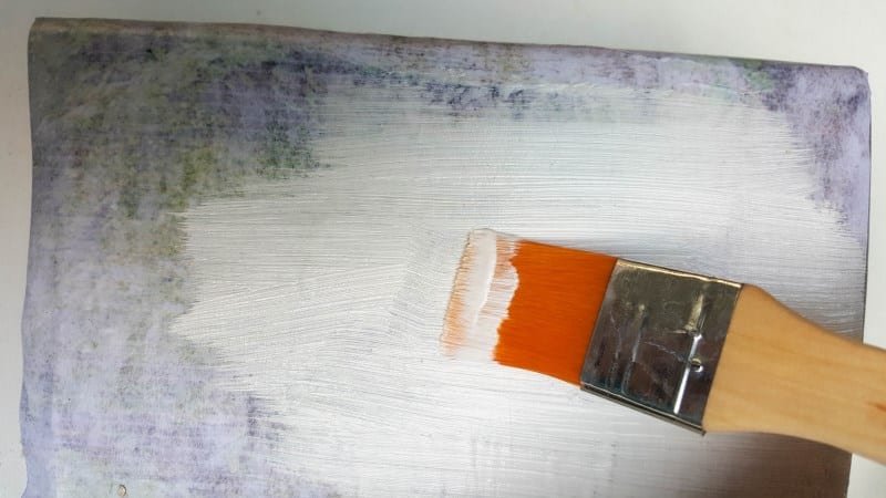 Paint over the image to seal and block out light