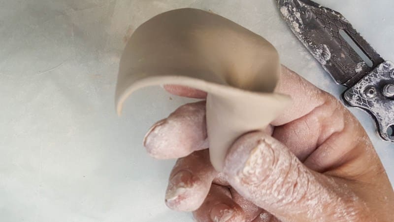 Use your hands to shape the arum lily
