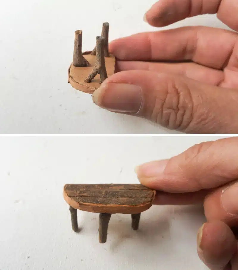 Glue the twigs onto the bottom of the piece of cardboard