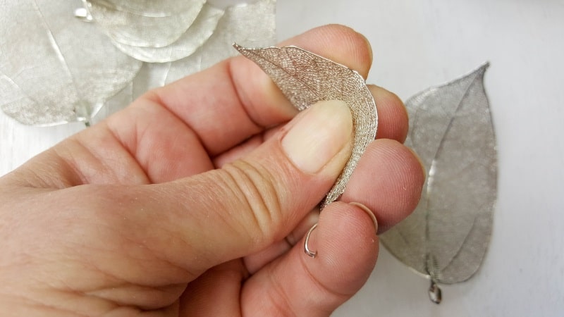 Lightly press the middle of the skeleton leaves so they curve around