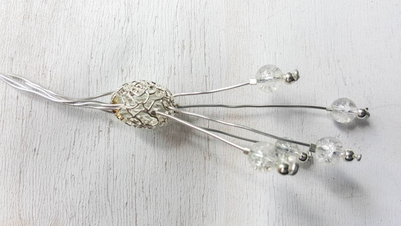 Slide the stamen into the oval bead