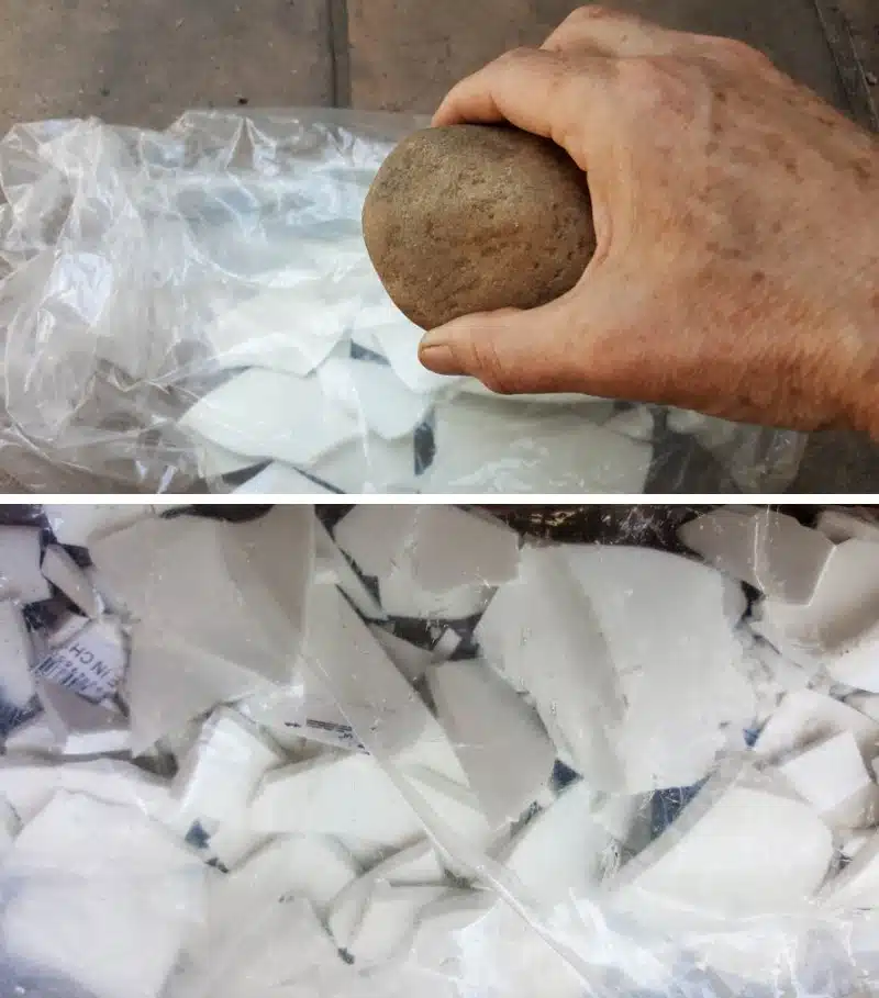 Use a large pebble to break the broken pieces into smaller bits