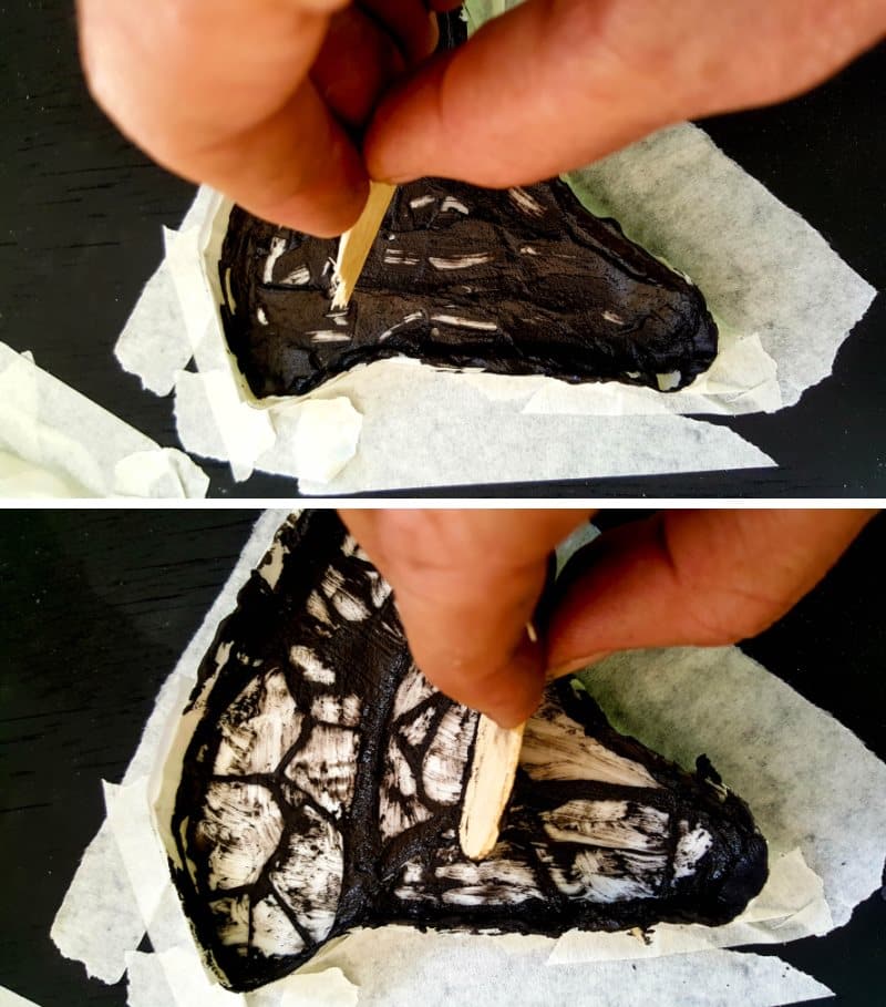 Use a broken ice cream stick to apply the grout in small, tight spaces