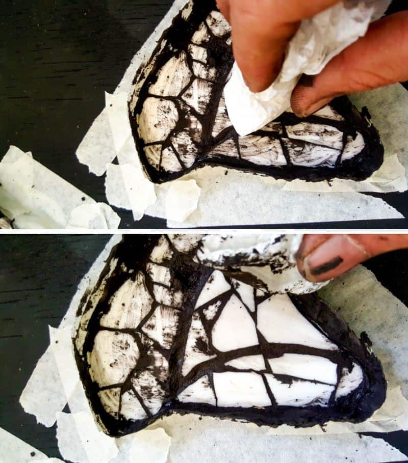 Wipe of any excess grout with a damp kitchen towel or cloth.