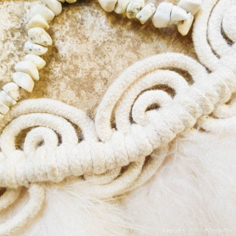 Handmade Raffia Collar Necklace Home D&eacute;cor or Wall Hanging using cardboard and beads. Quick, easy, budget-friendly, and fun to put together, it will add a touch of tribal boho to any space. Get the free step-by-step tutorial at A Crafty Mix. #BohoDecorDIY #ACraftyMix
