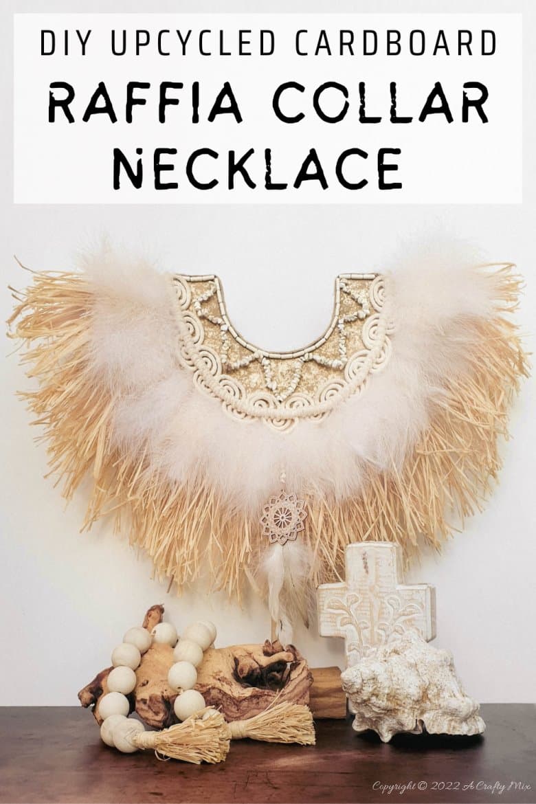Handmade Raffia Collar Necklace Home D&eacute;cor or Wall Hanging using cardboard and beads. Quick, easy, budget-friendly, and fun to put together, it will add a touch of tribal boho to any space. Get the free step-by-step tutorial at A Crafty Mix. #BohoDecorDIY #ACraftyMix