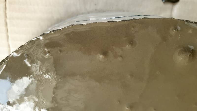 Gently pour the fast setting concrete inside and fill to the top