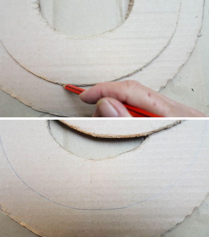 Mark the overlap between the thin and thick cardboard arches