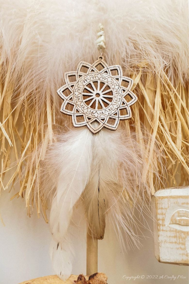 Handmade Raffia Collar Necklace Home D&eacute;cor or Wall Hanging using cardboard and beads. Quick, easy, budget-friendly, and fun to put together, it will add a touch of tribal boho to any space. Get the free step-by-step tutorial at A Crafty Mix. #BohoDecorDIY #ACraftyMix