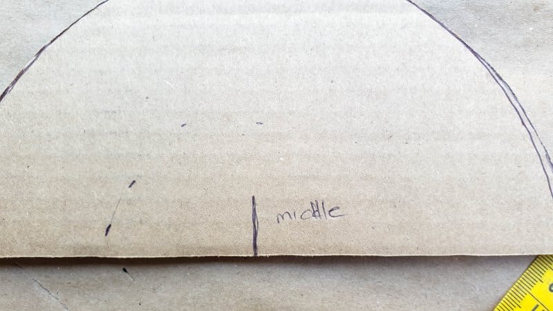 Mark the middle point of the cardboard semi-circle
