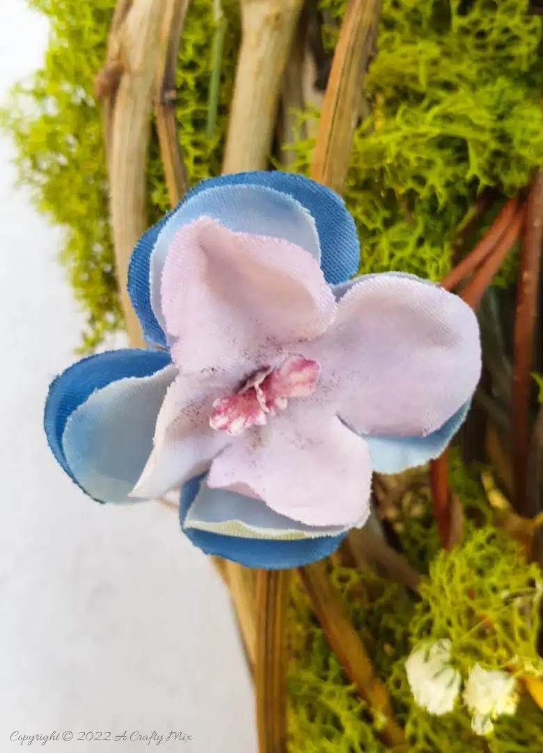 This how-to guide will show you how to make a gorgeous crescent moon wreath from scratch. It includes a step-by-step video tutorial to make fantasy-inspired curly top mushrooms. #ACraftyMix #FantasyWreath