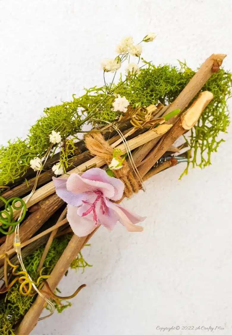 This how-to guide will show you how to make a gorgeous crescent moon wreath from scratch. It includes a step-by-step video tutorial to make fantasy-inspired curly top mushrooms. #ACraftyMix #FantasyWreath