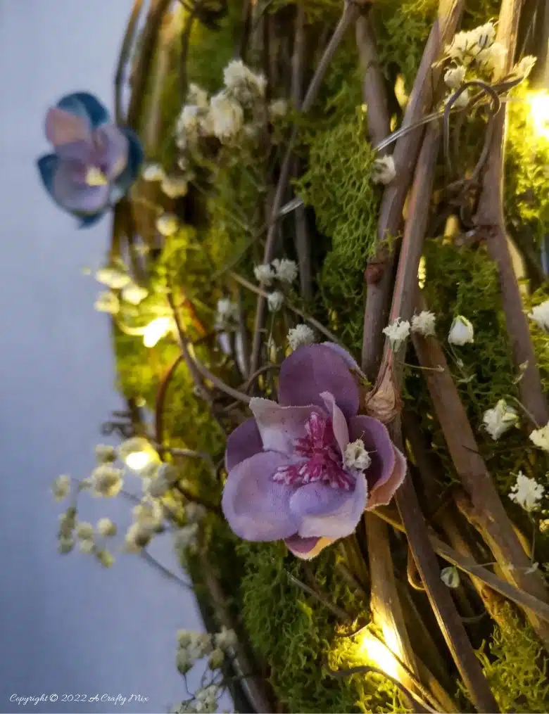 This how-to guide will show you how to make a gorgeous crescent moon wreath from scratch. It includes a step-by-step video tutorial to make fantasy-inspired curly top mushrooms. #ACraftyMix #FantasyWreath