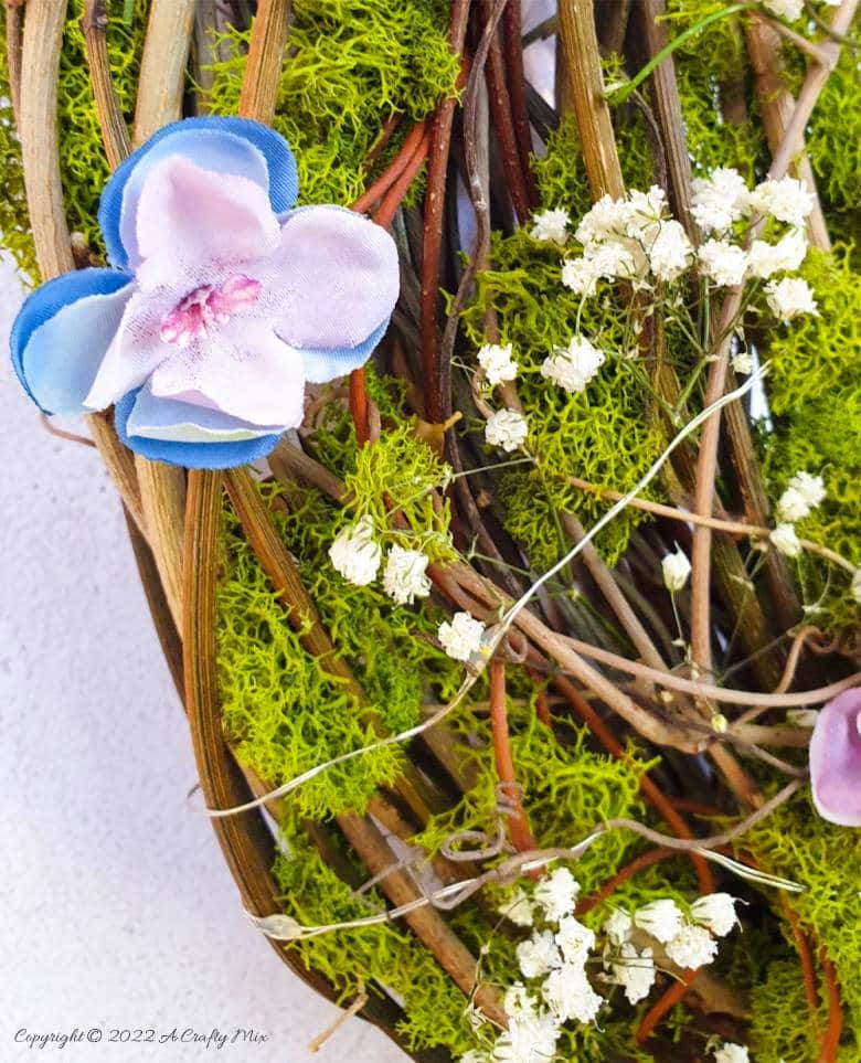 This how-to guide will show you how to make a gorgeous crescent moon wreath from scratch. It includes a step-by-step video tutorial to make fantasy-inspired curly top mushrooms. #ACraftyMix #FantasyWreath
