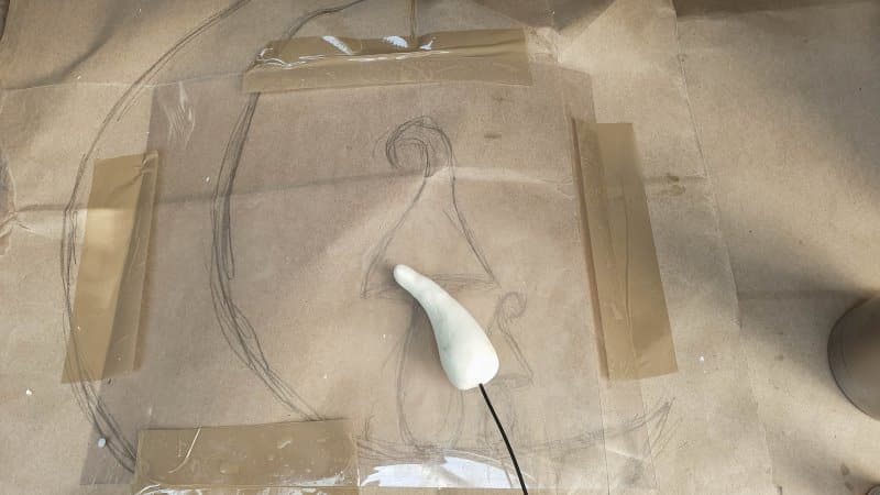push some craft wire inside the mushroom stalks before baking or air drying so they can be attached to the crescent moon