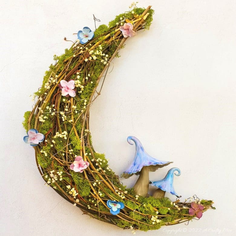 This how-to guide will show you how to make a gorgeous crescent moon wreath from scratch. It includes a step-by-step video tutorial to make fantasy-inspired curly top mushrooms. #ACraftyMix #FantasyWreath