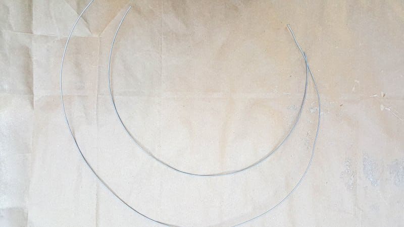 Cut two pieces of wire. One a little longer than the other