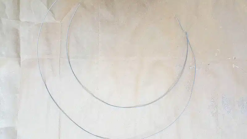 Cut two pieces of wire. One a little longer than the other