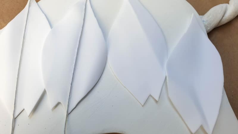 Glue craft wire to one of the ears