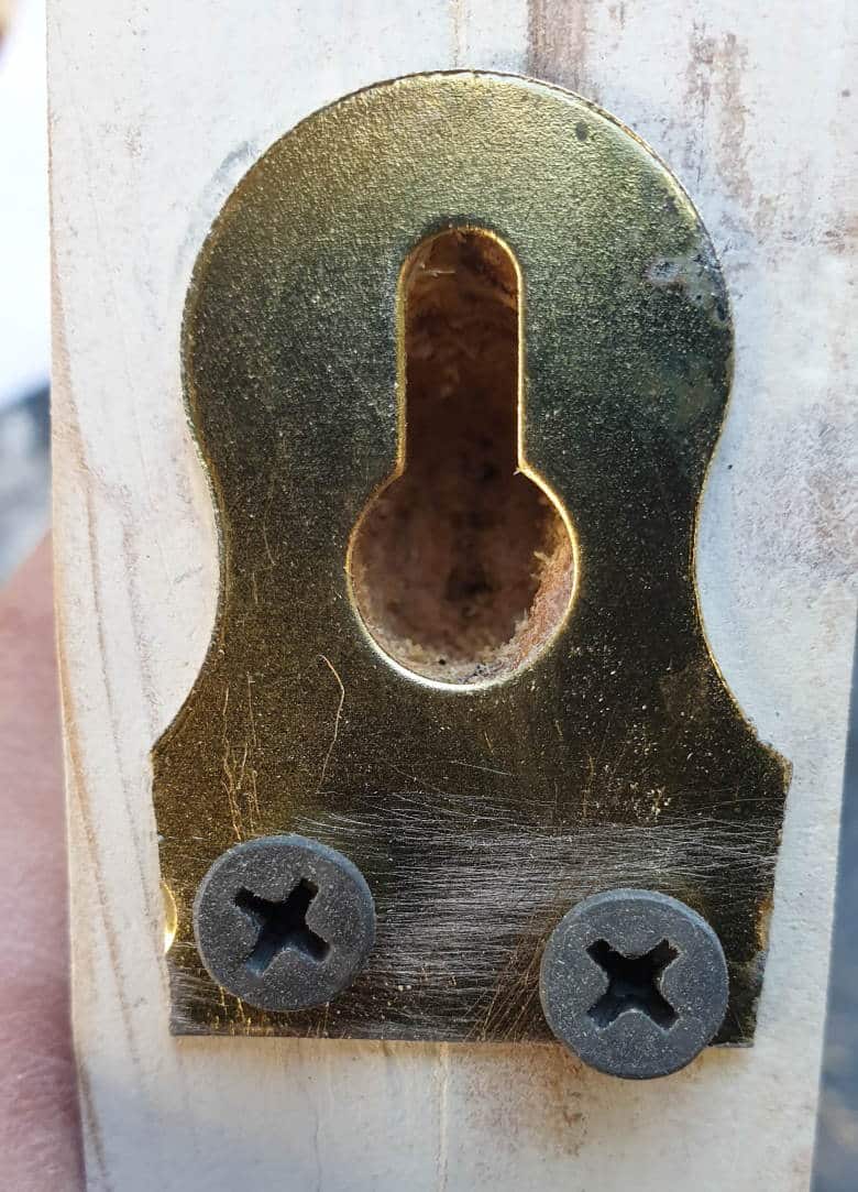 Screw the slotted hanger into the back of the unicorn's head