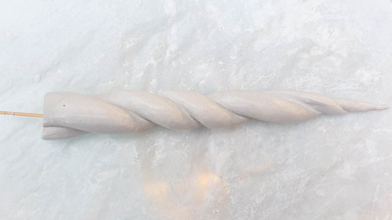 Insert a toothpick in the bottom of the unicorn horn