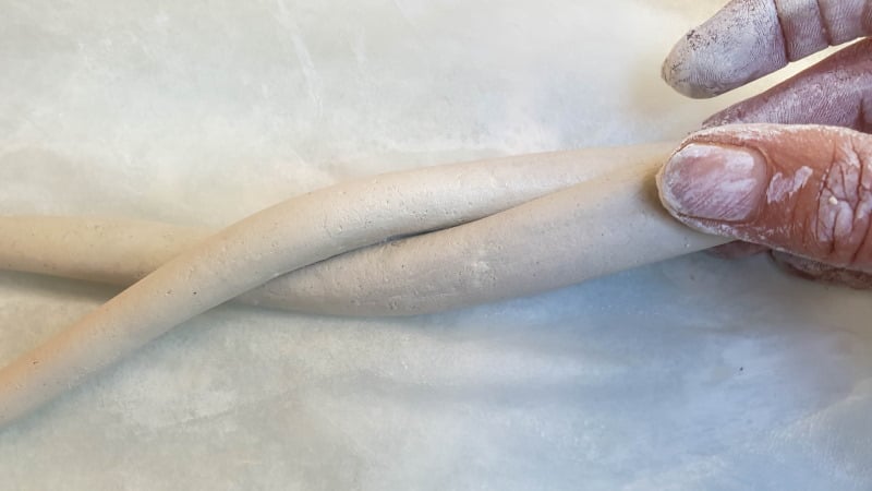 Twist the clay worm shapes together