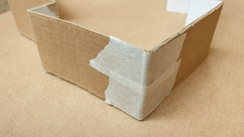 Strips of masking tape will join the cardboard together