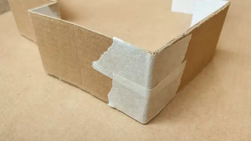 Strips of masking tape will join the cardboard together